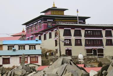 Tengboche Monastery in Nepal, with colorful architecture and a golden spire; it is a Largest Monastery in Khumbhu