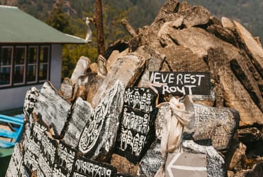 Stack of inscribed stone tablets with  EVEREST ROUTE  sign