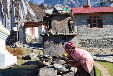 Local People prayingg in mani stones at Langtang Kyanjin gompa