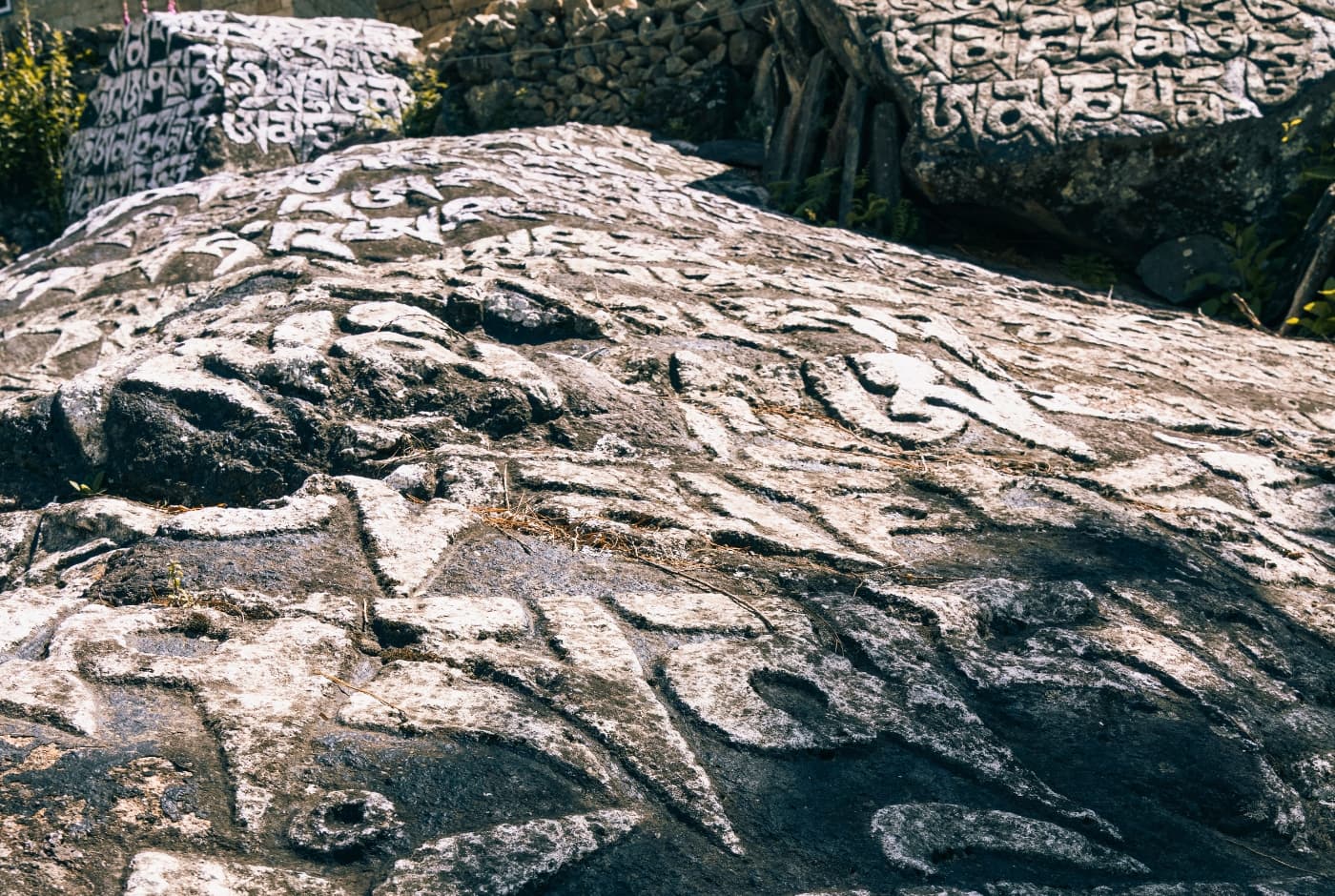 Mani stones, Tibetan script, stone carvings   monjo , Everest Trek