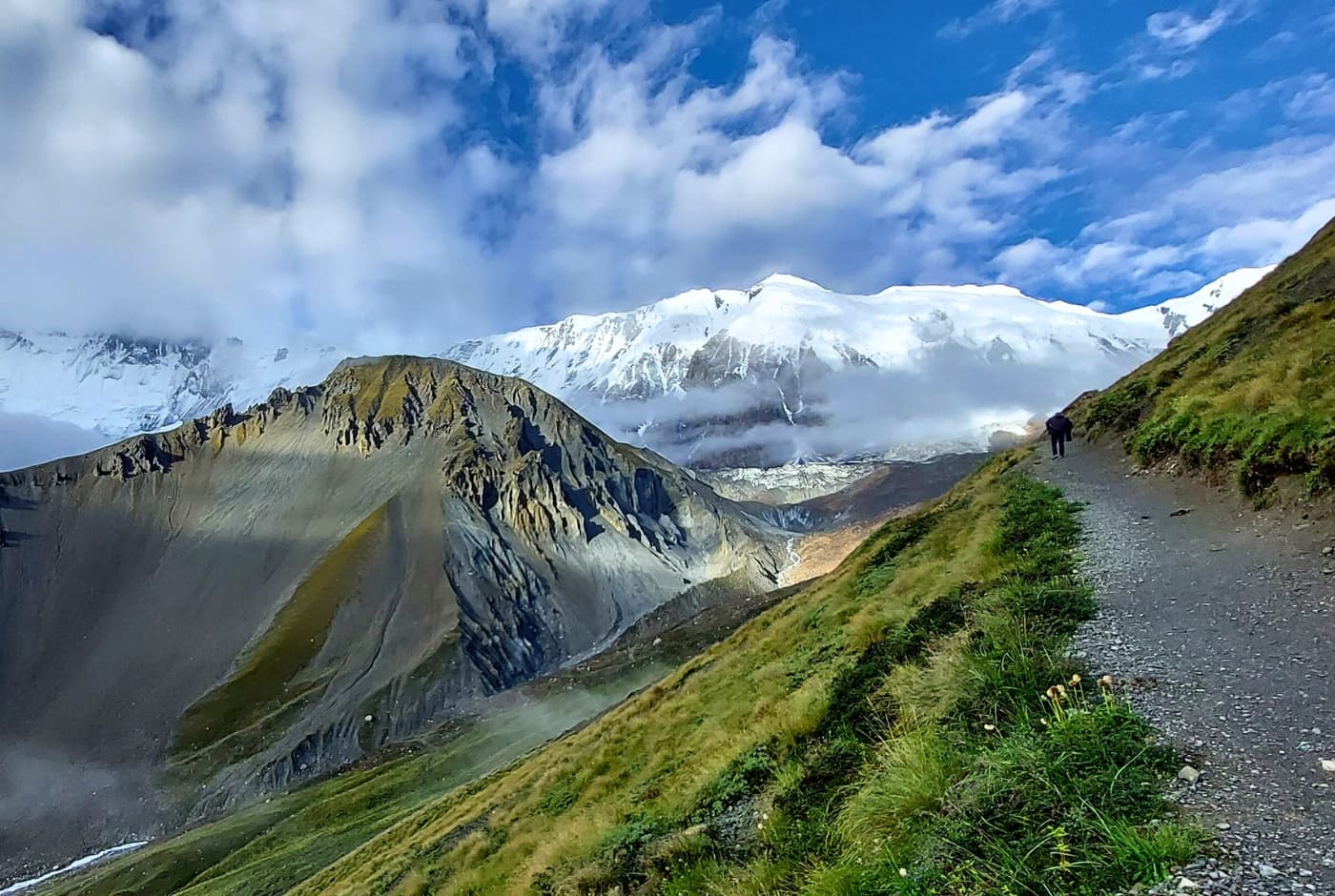 Trekking path with a view of Gangapurna and Annapurna III mountains on the Annapurna Circuit, Nepal