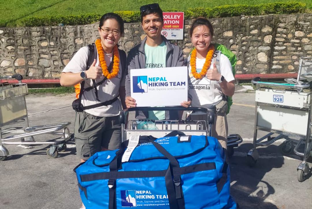 Everest Base Camp trek participants with Nepal Hiking Team staff at Kathmandu airport preparing for hotel transfer.