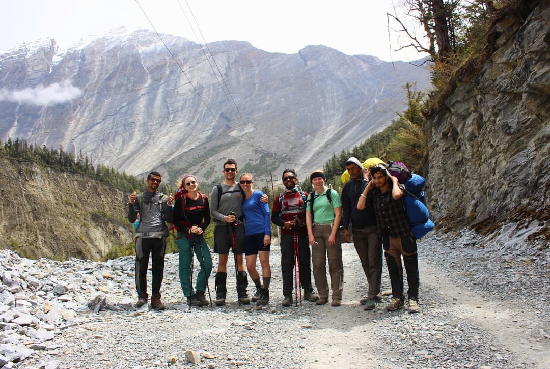 Group photo is likely taken near Pisang