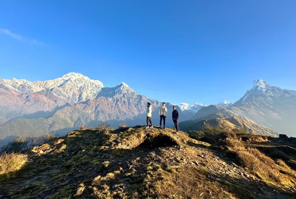 Trekkers during Mardi Himal Trek, just before Machhapuchhare, Annapurna South and Hiunchuli
